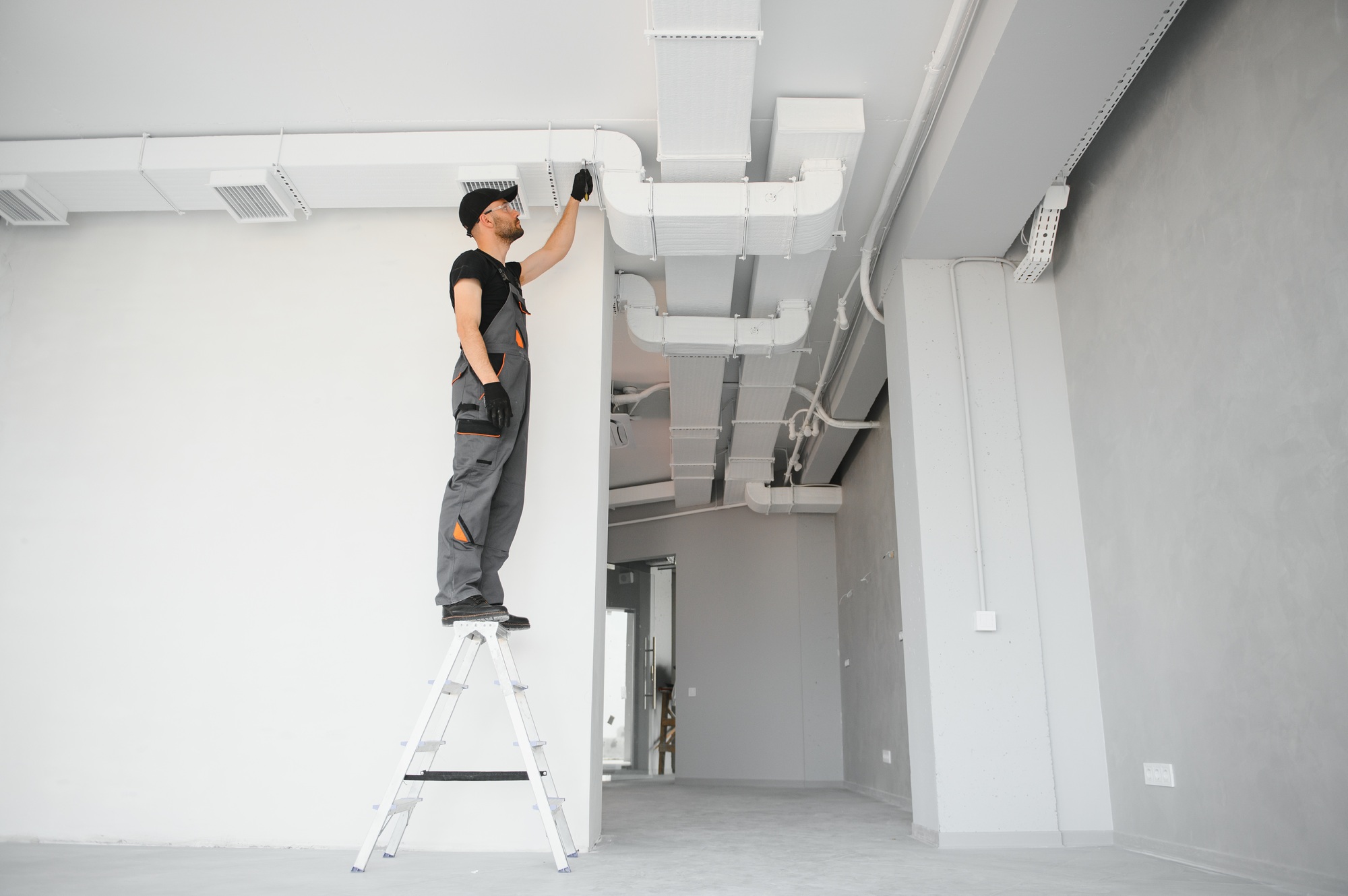 hvac technician at work. ventilation, heating system maintenance and repair